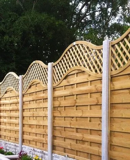 Decorative wave-top garden fencing installed by Marshall Driveways Ltd