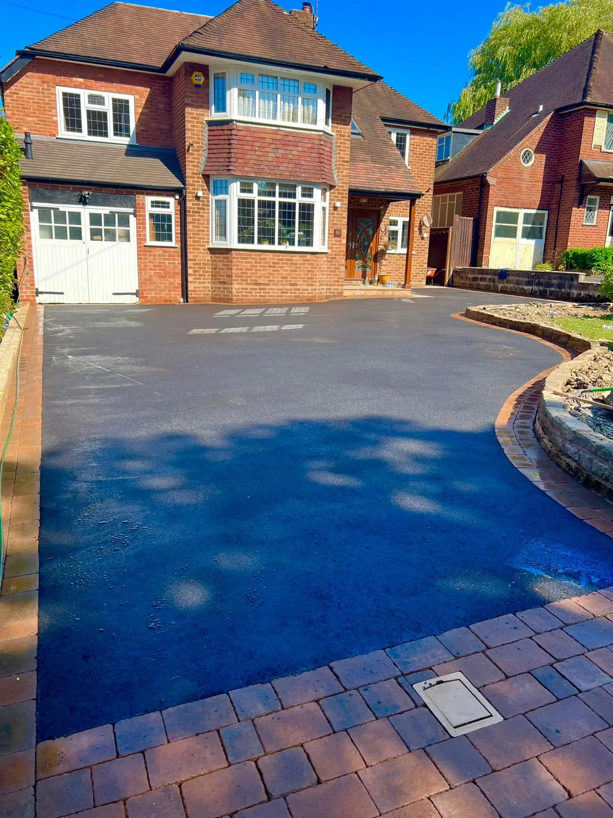 Marshall Driveways Ltd team completing a tarmac driveway installation in Wolverhampton